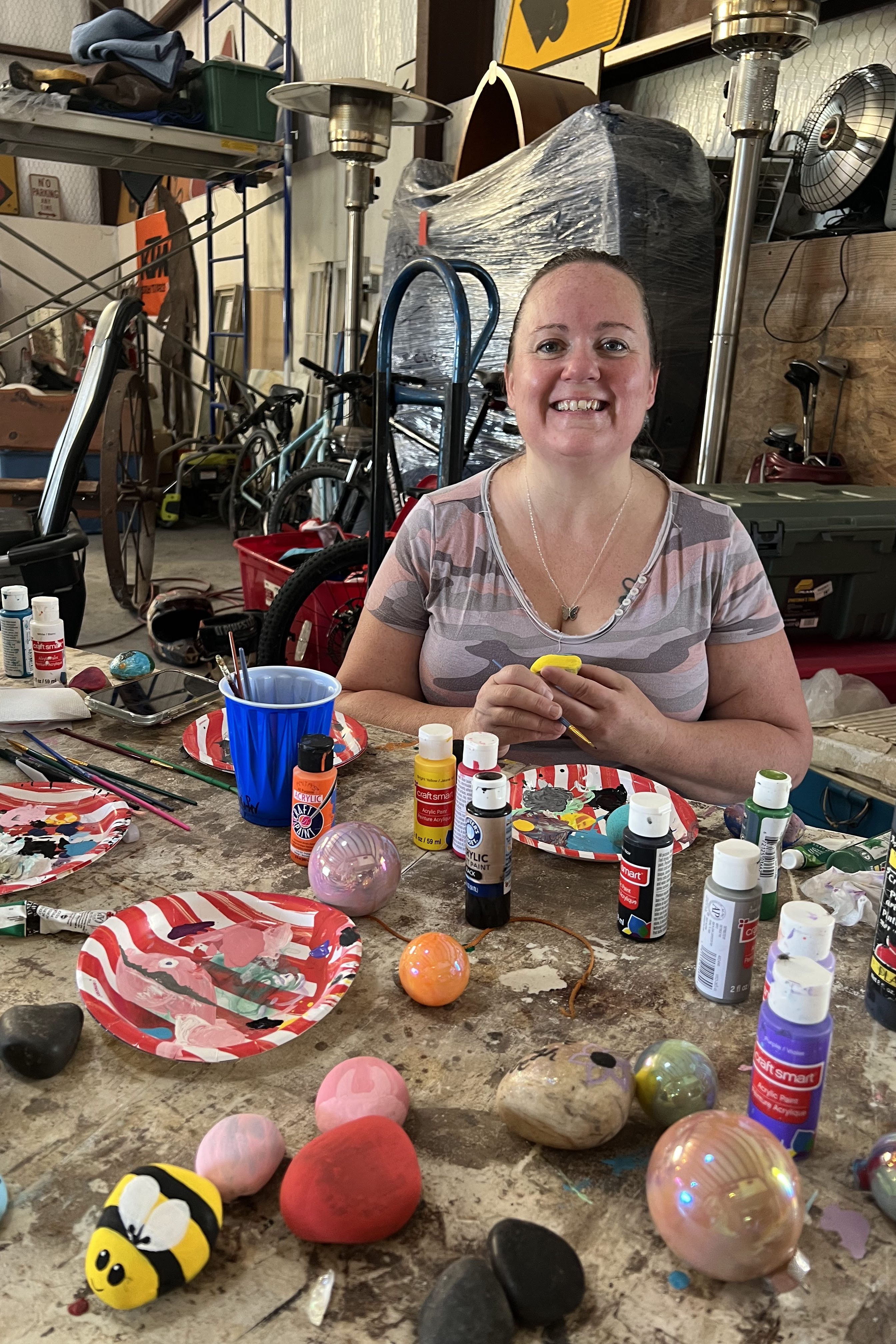 braving the heat to paint a rock
